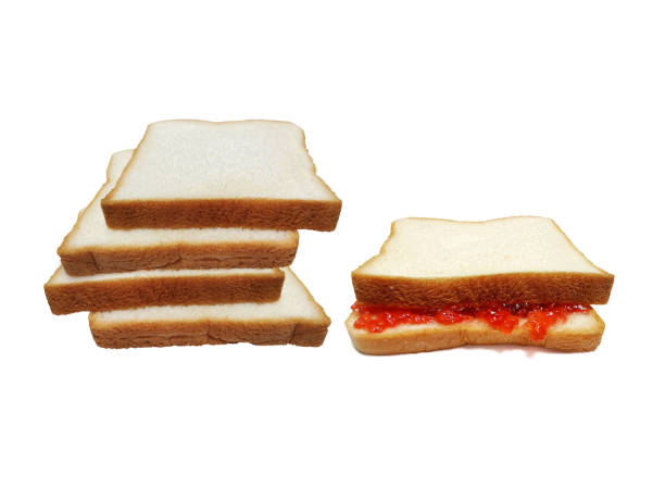 istock slice of bread with strawberry jam isolated on white 1396244574