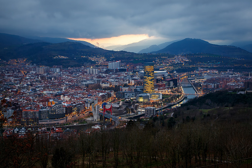Dusk, twilight over Bilbao city in Basque Country, Spain. Town between mountains