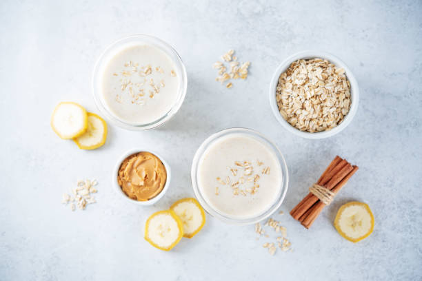 Peanut butter oats banana smoothie in a glass stock photo
