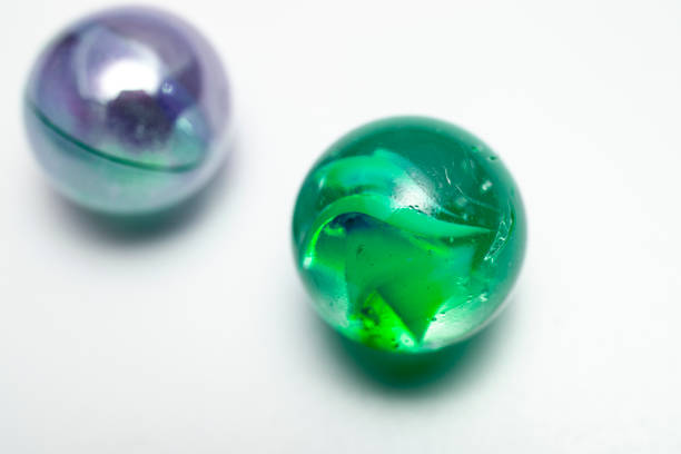 istock colored marbles. close-up macro photo. on white background 1396247103