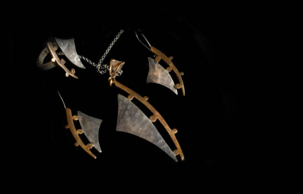 istock silver jewelry set isolated on black background. 1396247377