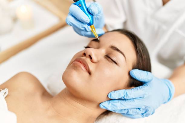 istock Young latin woman relaxed having microblading eyebrows treatment at beauty center 1396247378