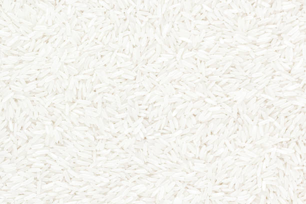 Jasmine rice texture background Jasmine rice texture background jasmine rice stock pictures, royalty-free photos & images