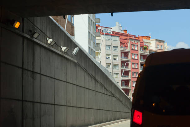 istock Urban road tunnel exit, car driving. 1396250765