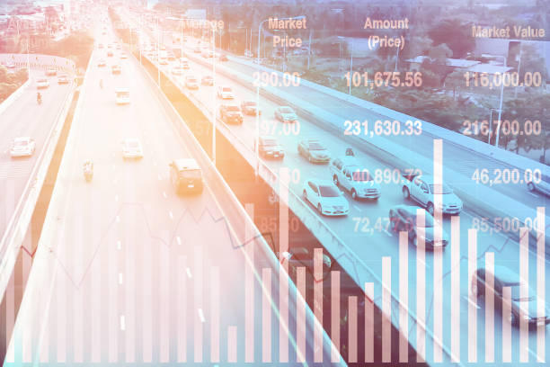 istock Stock financial index data with graph and chart show successful data investment on transportation and travel industry with blurry aerial view image of traffic for presentation and report background. 1396257506