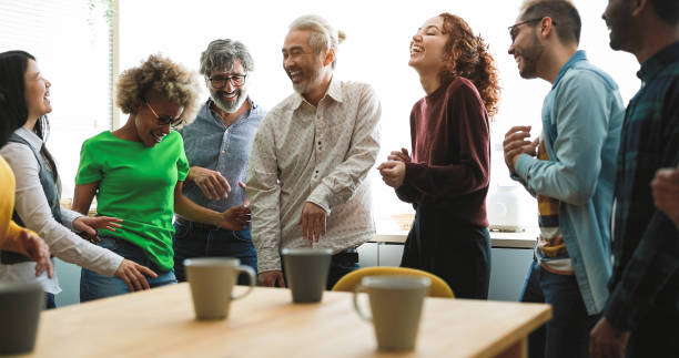 istock Multi generational friends having fun dancing at home kitchen - Focus on left senior man face 1396258433