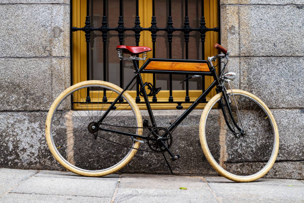 istock Retro bicycle leaning against a street wall under a window. 1396260279