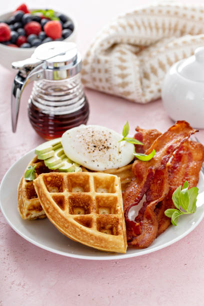 istock Crispy Belgian waffles with avocado and bacon for breakfast 1396261484
