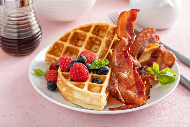 istock Belgian waffles with bacon and fresh berries for breakfast 1396261508