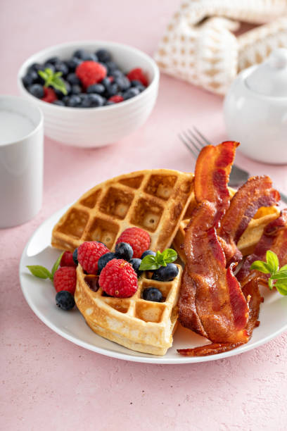 istock Belgian waffles with bacon and fresh berries for breakfast 1396261510