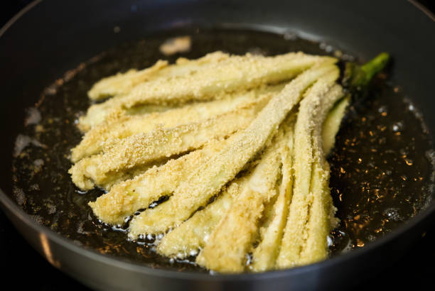 istock Eggplant fried in a pan in boiling oil. 1396261784
