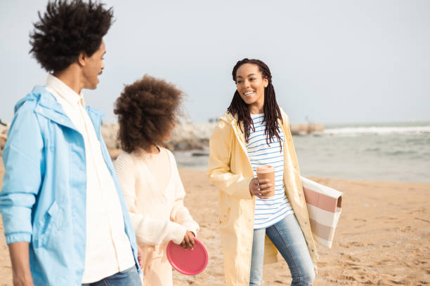 istock Happy Afro family on vacation going on a beach picnic 1396262073