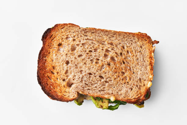 istock Single avocado sandwich over white isolated background 1396262745