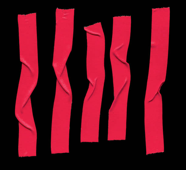 istock set of red fabric tape stripes on dark background. 1396263975