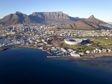 Cape Town, South Africa - 19 April 2022: Aerial view over Cape Town, with Cape Town stadium and Table Mountain .