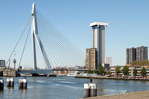 Cityscape of Rotterdam with modern skyscrapers, the Euromast and the bridge over the river Maas.