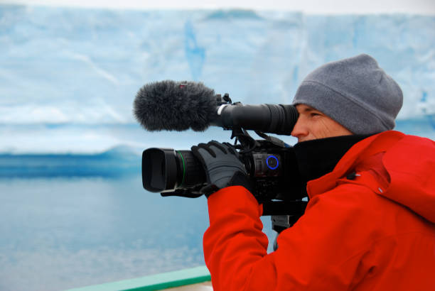 istock Cameraman filming an iceberg in Antarctica 1396269027