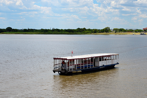 Asuncion, Paraguay: small ferry boat on the Paraguay river, Asuncion bay - connects the city to Banco San Miguel, near the Club Náutico Nacional El Mbiguá.