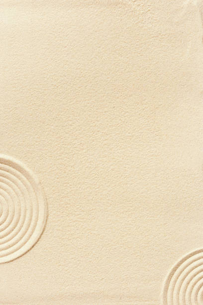 istock Aesthetic minimalist pattern in Japanese Zen Garden with concentric circles on sand, beautiful sandy texture, Spa background, concept for meditation and relaxation. Top view fine sand 1396273012