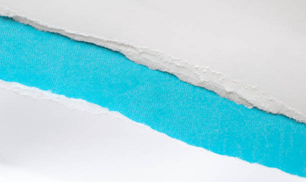 istock pieces of torn paper on a blue background. copy space 1396275401