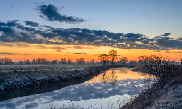istock Morning misty canal on a summer morning 1396276678