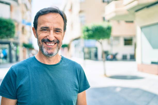 istock Middle age man with beard smiling happy outdoors 1396277073
