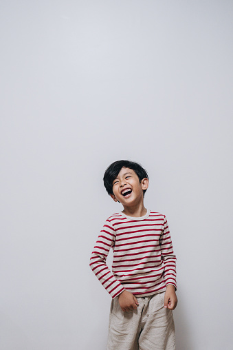 Portrait of adorable young happy boy