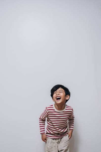Portrait of attractive handsome young man in casual clothes standing isolated on blue wall background in studio. People sincere emotions, lifestyle concept. Mock up copy space.