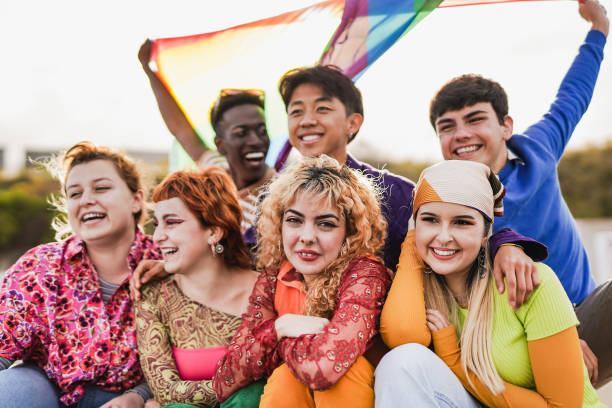 istock Young multiracial people celebrating together at LGBT pride parade 1396281016