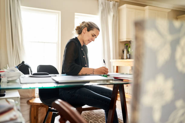 istock Young woman working from home office 1396282364