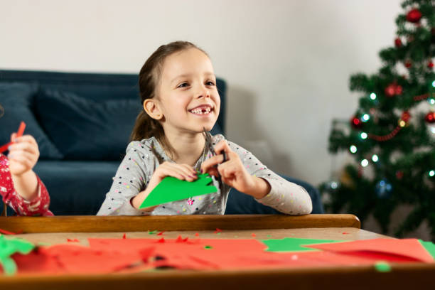 istock Children making Christmas decoration at home 1396282582