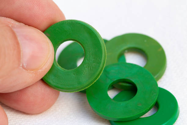 istock Green color rubber faucet gaskets. Rubber gaskets. Rubber Seals. 1396283830