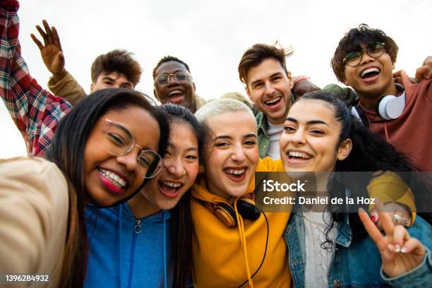 Group Of Multiracial Teen College Friends Having Fun Outdoors Happy People Taking Selfie Stock Photo - Download Image Now