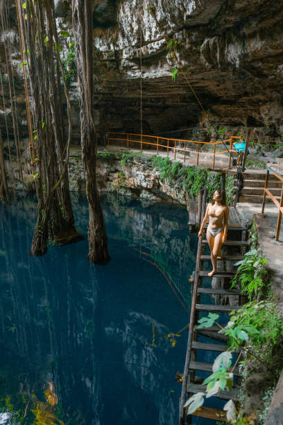 istock Woman in Cenote in Yucatan, Mexico 1396285149