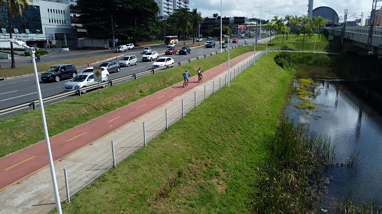 salvador, bahia, brazil - january 31, 2022: cyclist riding a bicycle on a bike path on Avenida Luiz Viana - Paralela - in the city of Salvador