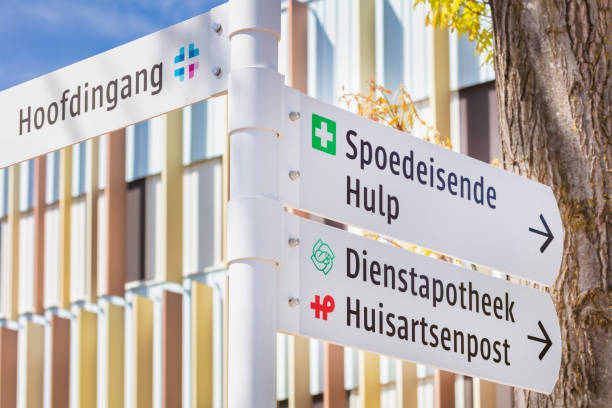 Sign with the Dutch text for "Main entrance", "Emercengy care",  "Service pharmacy" and "GP / family doctor medical centre" in Arnhem, The Netherlands Arnhem, The Netherlands - May 4, 2022: Route sign with the Dutch text for "Main entrance", "Emercengy care",  "Service pharmacy" and "GP / family doctor medical centre" in Arnhem, The Netherlands arnhem photos stock pictures, royalty-free photos & images
