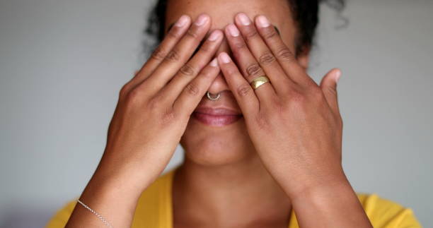 istock Pensive black woman rubbing face with hands thinking 1396286924