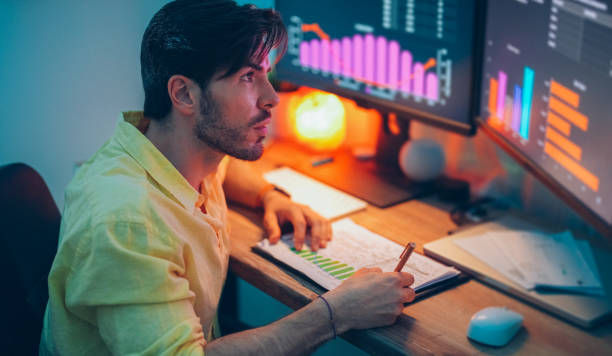 istock Businessman at home working late 1396288810