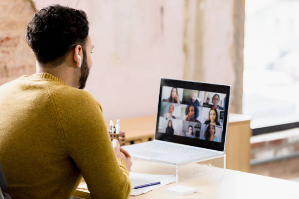 istock Unrecognizable male manager meets virtually with diverse staff 1396288919