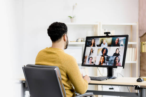 istock Unrecognizable man attends video conference meeting with diverse co-workers 1396288929