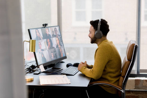 istock Profile view businessman attending video conference with co-workers 1396288941