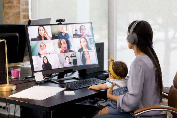 istock Co-working mom attends team meeting 1396288964