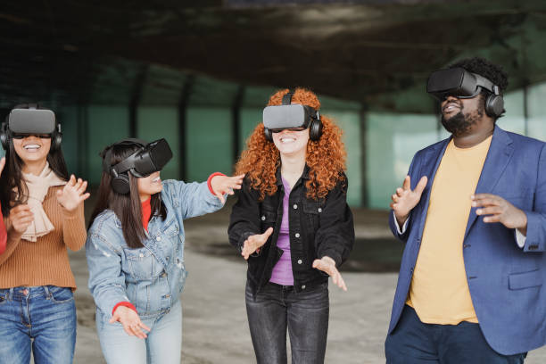 istock Happy multiracial friends having fun using 3d virtual reality goggles outdoor 1396290320