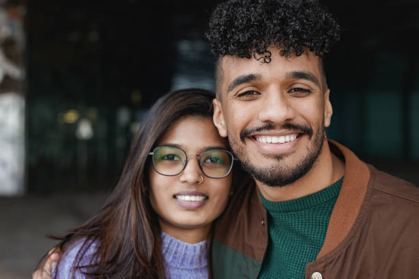 istock Happy multiracial couple smiling on camera 1396290326