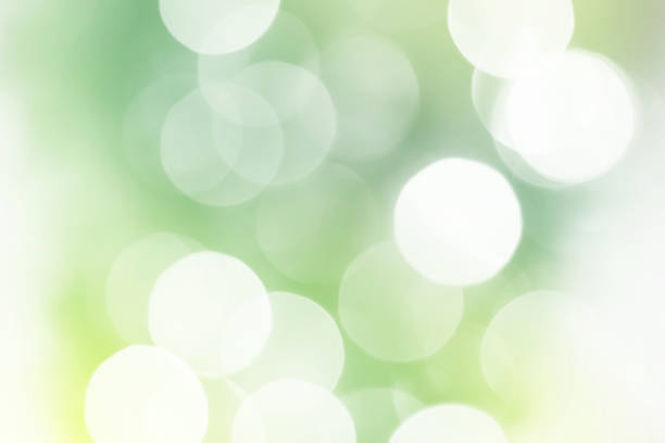 Summer green sparkling glitter bokeh background Summer green sparkling glitter bokeh background, abstract defocused lights texture mint green stock pictures, royalty-free photos & images