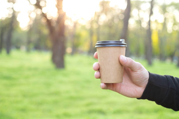 a craft cup of coffee in hand free space for text