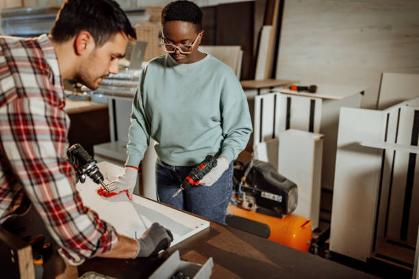 istock Carpenters working together to assembly the shelf 1396295869