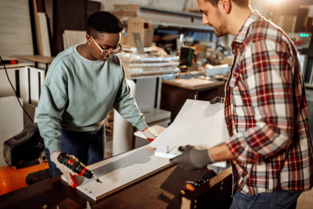 istock Carpenters working together to assembly the shelf 1396295926