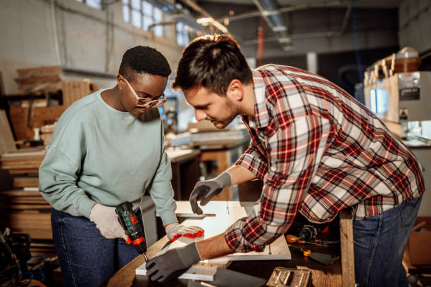 istock Carpenters working together to assembly the shelf 1396295927