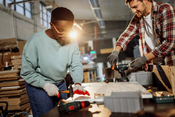 istock Carpenters working together to assembly the shelf 1396295929